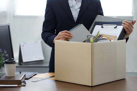Woman packing up office belongings - Wrongful Termination